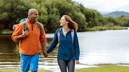 A couple holds hands while out for a hike.
SolStock/E+ via Getty Images 