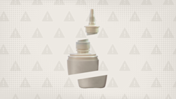 A nasal spray bottle cut into thirds is shown on a light gray background with a warning sign pattern.
GoodRx Health
