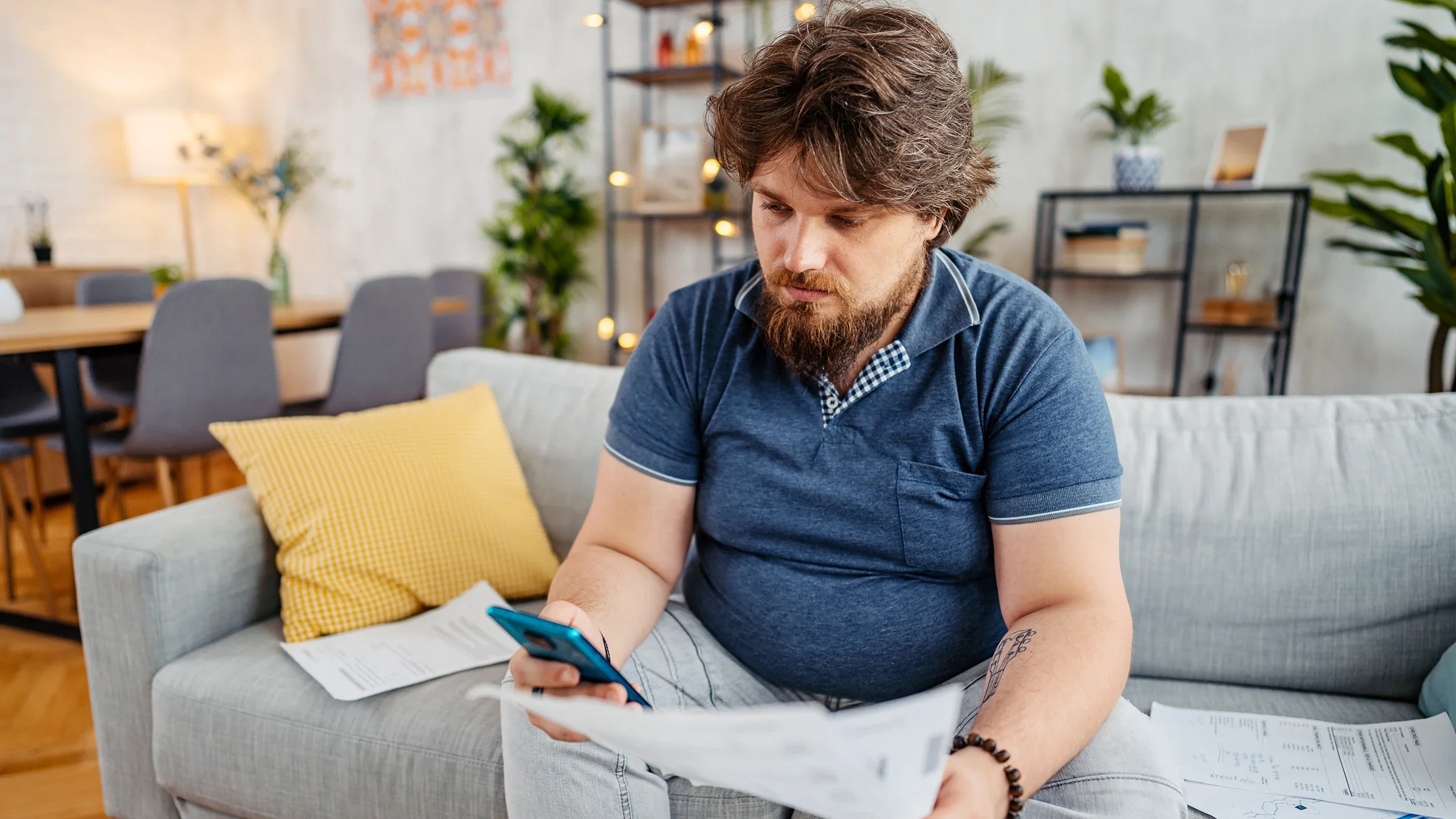 ozempic: man reviewing finances at home 1533515126