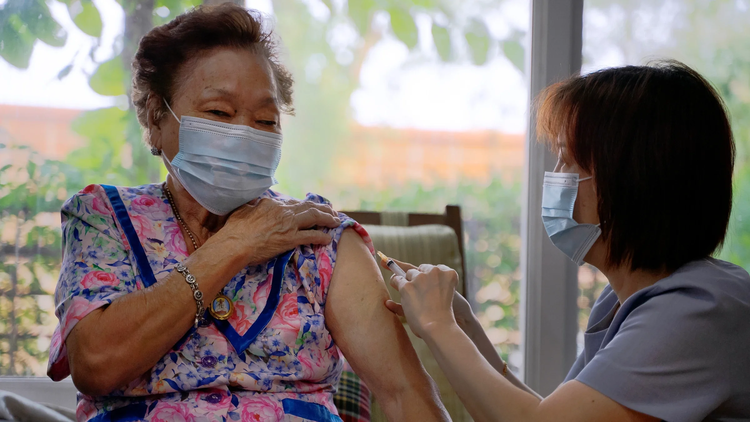 An older adult getting a vaccination.