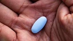 A man holds a blue pill in the palm of his hand.
Mutlu Kurtbas/iStock via Getty Images Plus