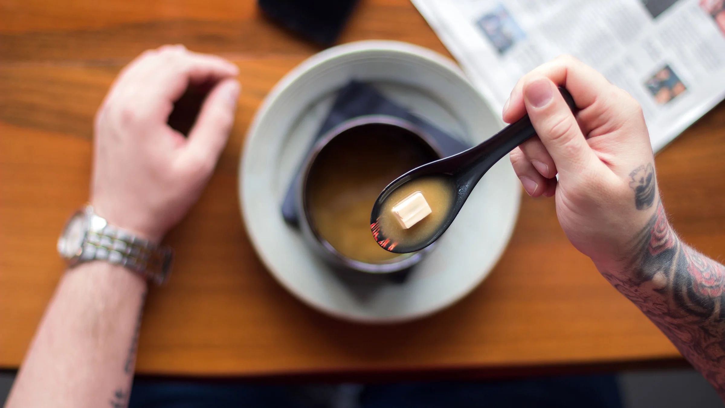 Close-up eating tofu miso soup.