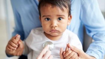 Children's Health: portrait of baby at medical appointment 1190214233
