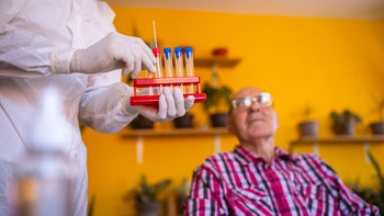 COVID-19: Testing: senior man PCR test 1335200299