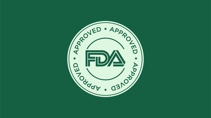 Round seal that reads "FDA Approved" on a green background.