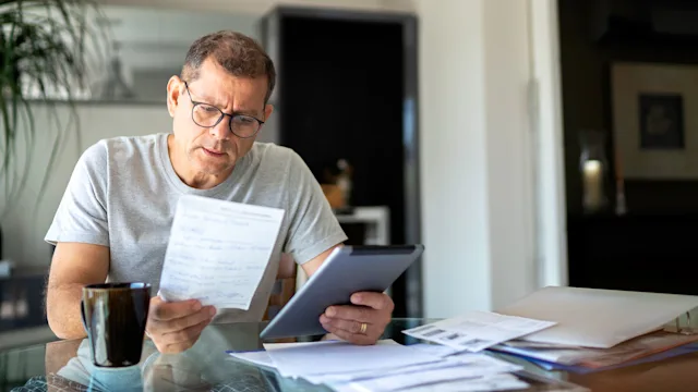 Medicare: man working from home 1143131282