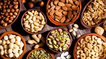 Diet Nutrition:mnuts on a wooden table 695071562