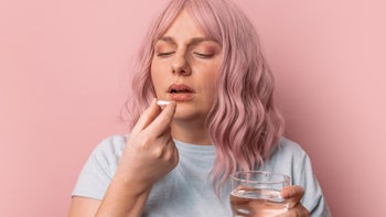 tamiflu: pink hair pink background taking pill 1367727576