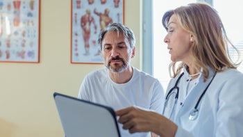 Prostate Cancer: doctor speaking to male patient 1329352517