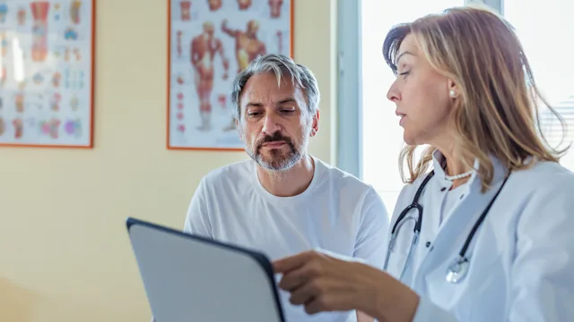 Prostate Cancer: doctor speaking to male patient 1329352517