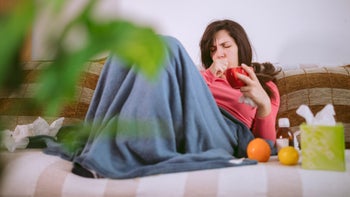 Flu: How long: sick person drinking hot beverage 1177380582
