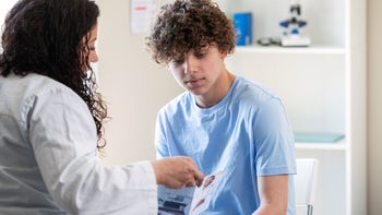 Health: Research: doctor with teenage patient 1425666586