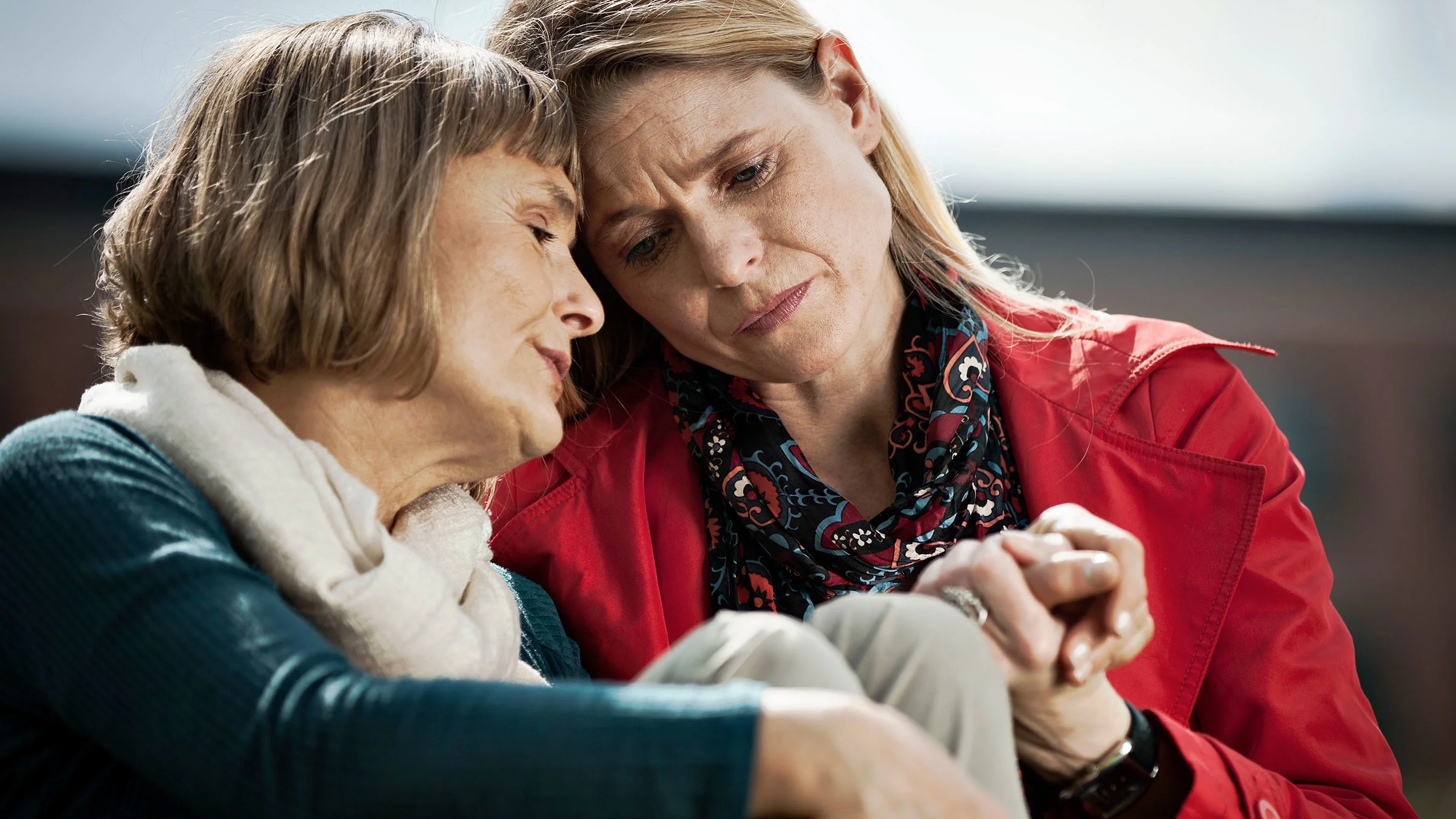 Someone is supporting their grieving friend.