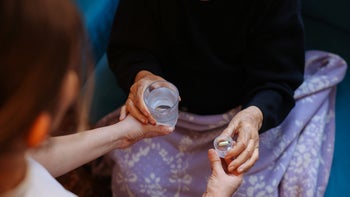 Senior health: closeup giving senior woman medication 1464263464