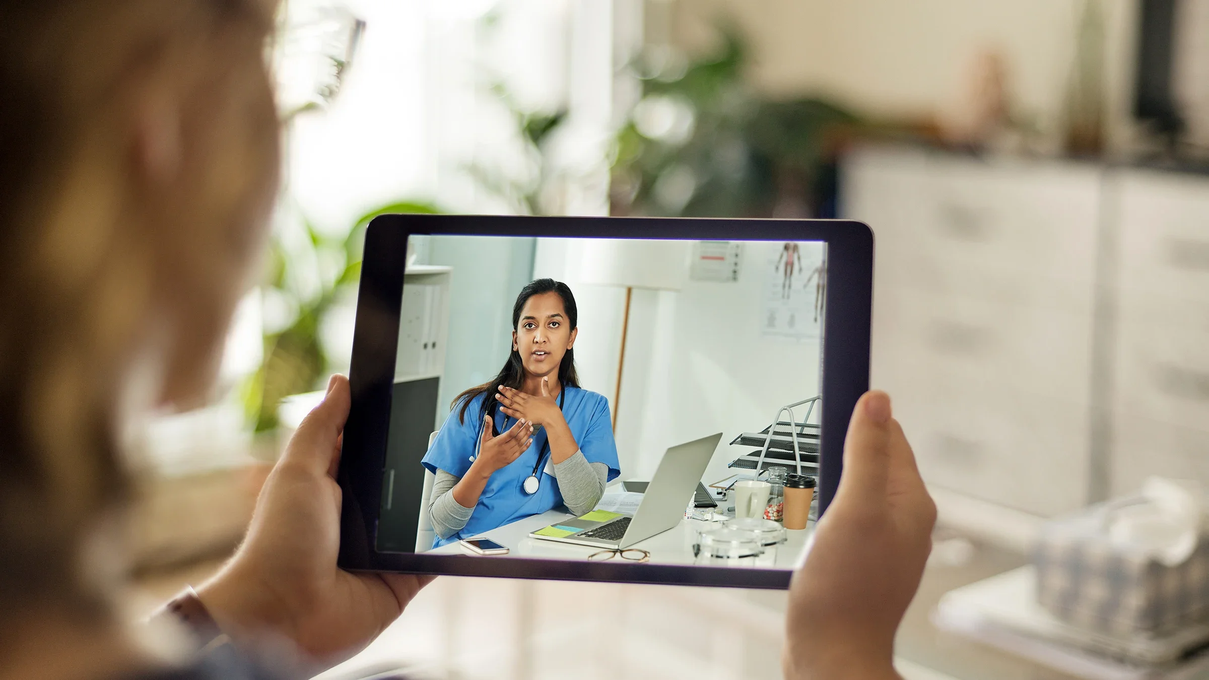 An older adult is talking during a telehealth appointment.
Riska/E+ via Getty Images