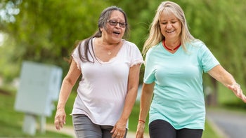 Health: Movement and exercise: older friends walking together-1256608424