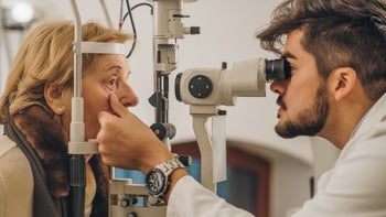 Macular Degeneration: Eye: older woman eye exam-904506124