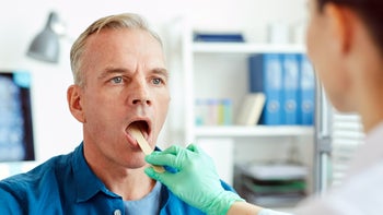 Throat: man throat examination 1250443497