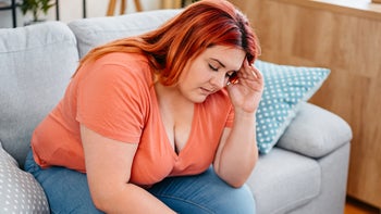 weight-loss: woman with headache 2164578887
