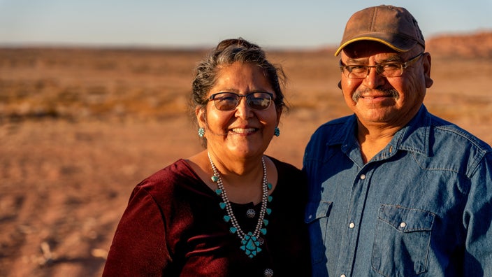Portrait of an Indigenous couple out in the desert.