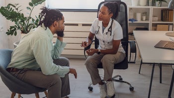 Black health: Colon cancer screening: doctor consulting patient 1717432659
