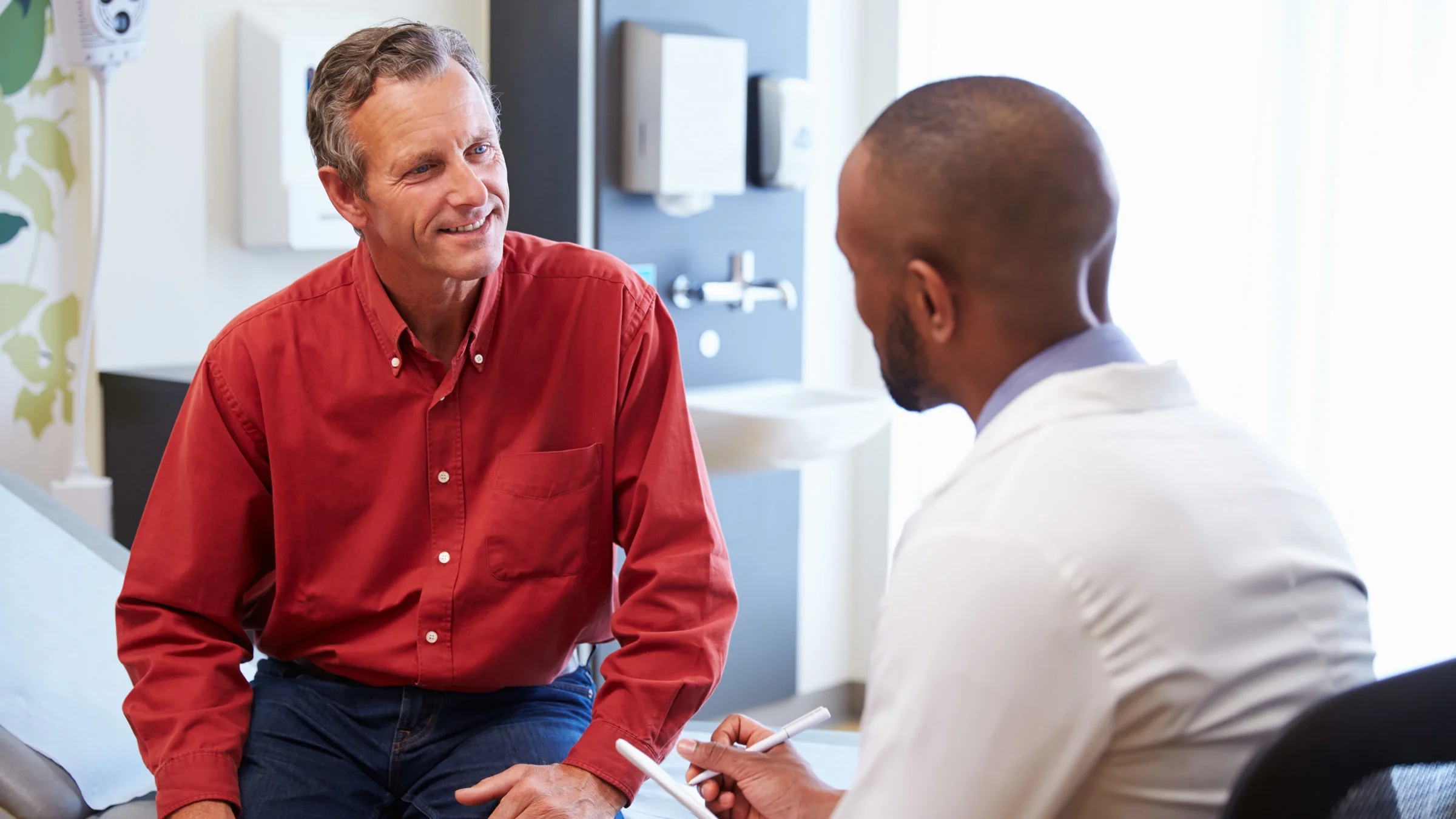 A doctor talking to a patient.