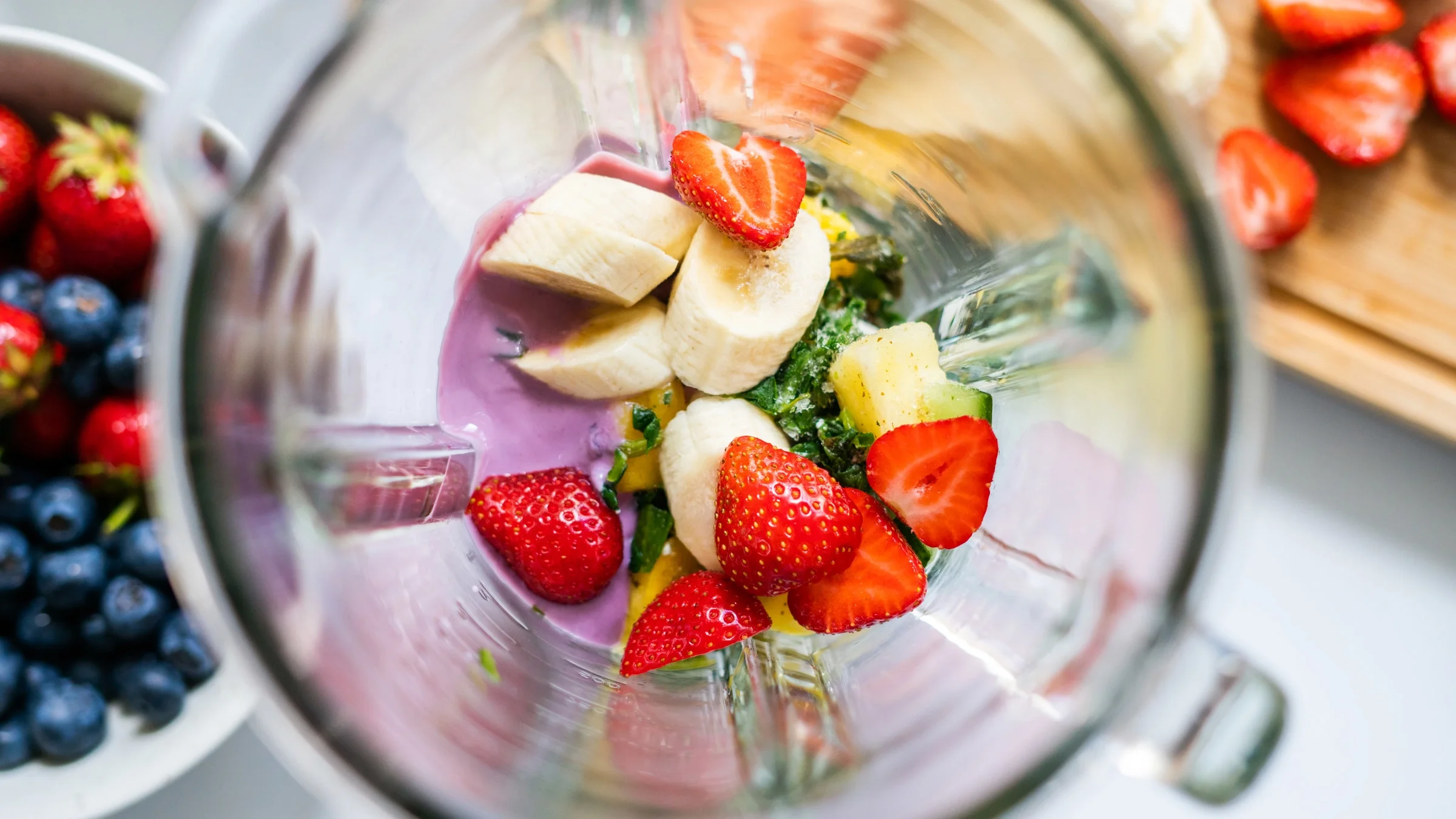 Top view of smoothie ingredients in a blender.