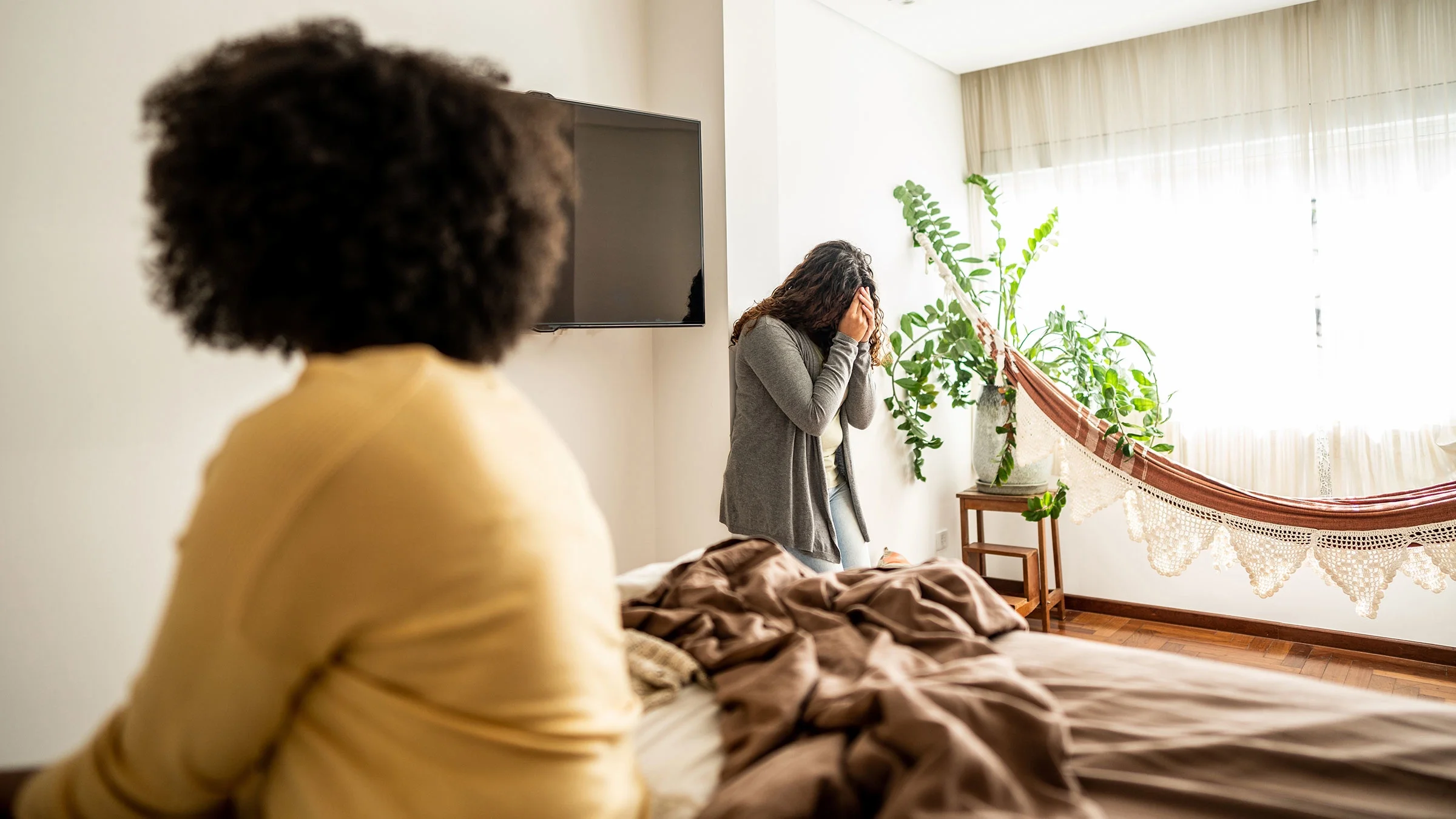 Couple fighting in their bedroom