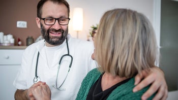 Patient advocacy: Undocumented: kind doctor embracing patient 1301209472