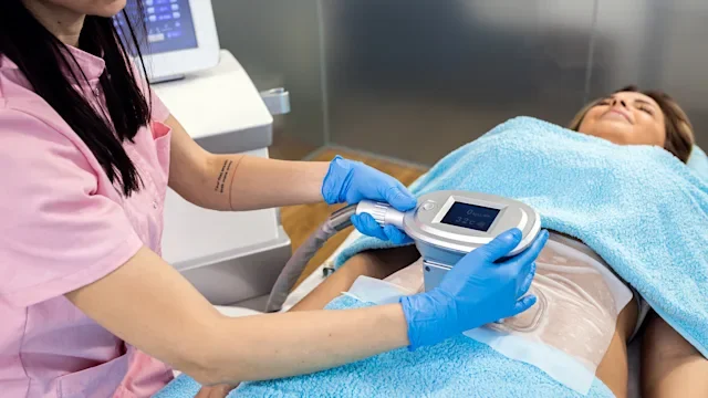 Health: Procedures: nurse applying device for fat freezing-1384220087