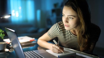 Personal Finance: woman taking note 1304790561