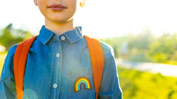 cropped shot child with denim shirt with rainbow-1365444357