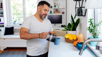 diet nutrition: man pouring cup of coffee 1450675748