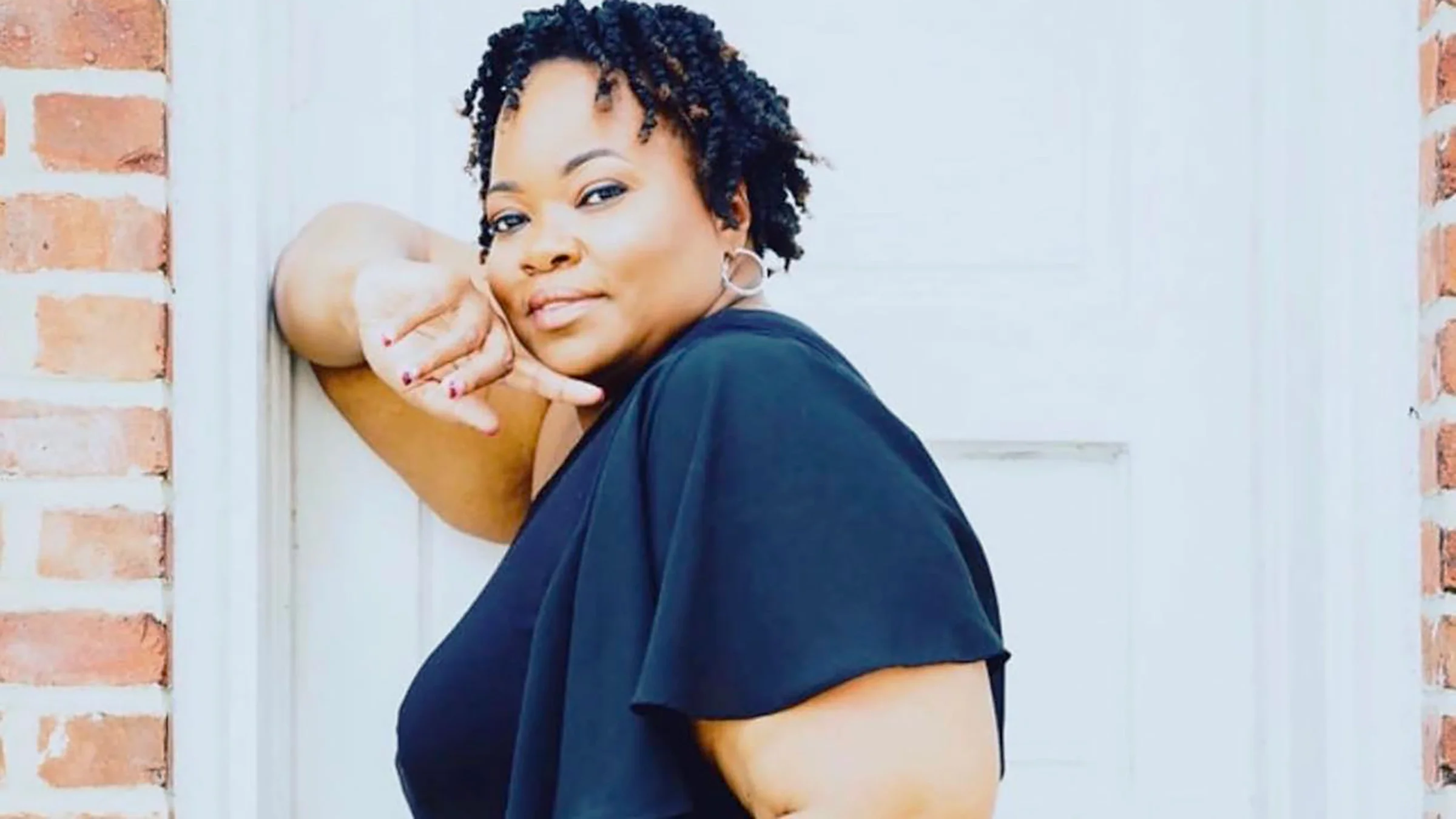 Portrait of Dollicia Green, outdoors.