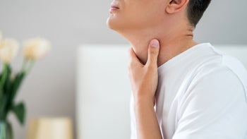 Sexual-health: closeup hand on throat 1331053892