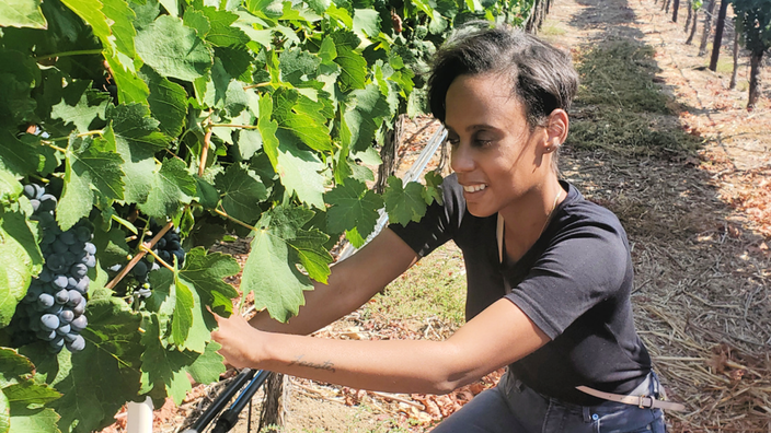 Chealynn Feaster is pictured in a vineyard.