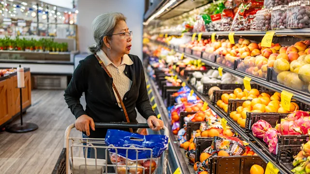 Diet and nutrition: senior woman in produce aisle 1696426702