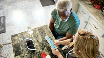 Medication Basics: caregiver organizing patient medication 1407450699