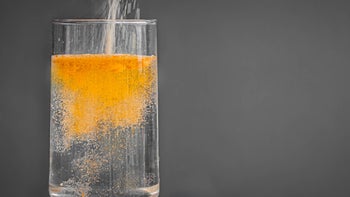 Supplement: closeup orange powdered drink in glass 1252813726