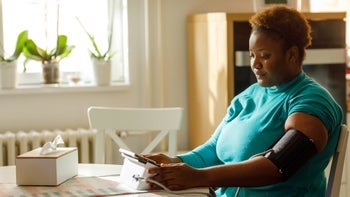 clonidine: woman checking blood pressure 1453983258