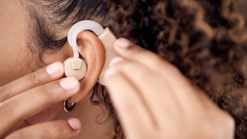 Ear: closeup hearing aid 1484833849