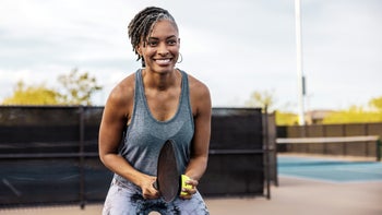 Movement exercise: woman playing pickleball 1410918411
