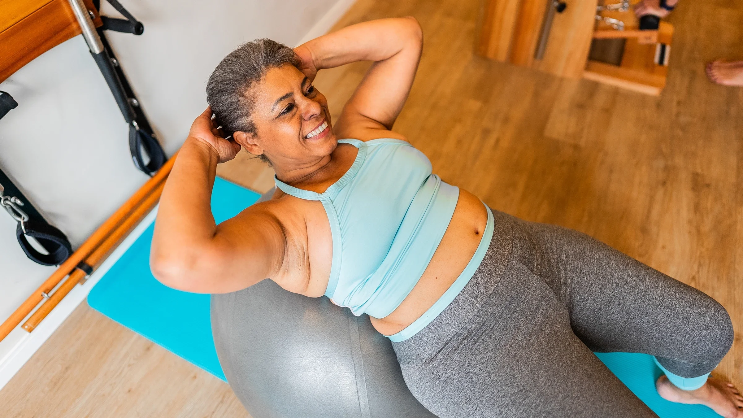 Woman doing crunches on an exercise ball