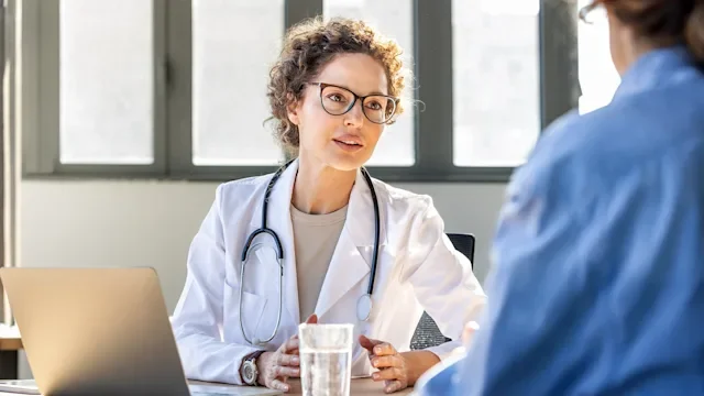 Rheumatology: HCP speaking to a patient 2269972896