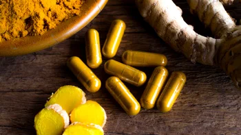 supplements-herbs: turmeric on wooden table 1367174201