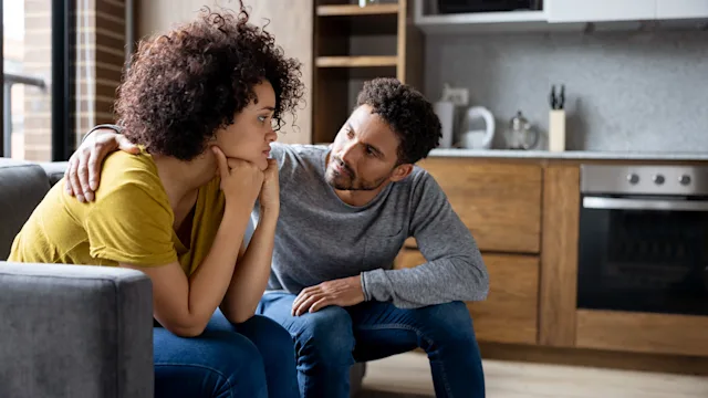 Breast cancer: mental health: man comforting girlfriend 1395273156