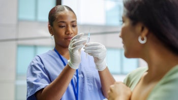 Pharmacy: medical professional prepping injection 1319297543