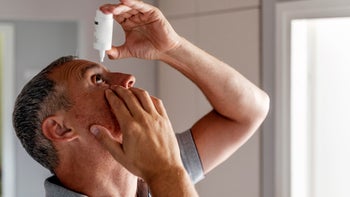 Health: Eye care: man putting in eye drops 1158024645