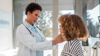 HCP examining thyroid 2172780572