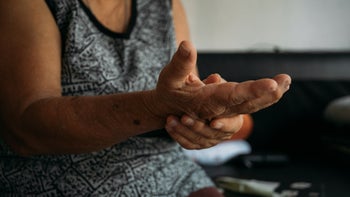 Health: Voltaren gel: cropped shot woman rubbing arthritic wrist-1214312283